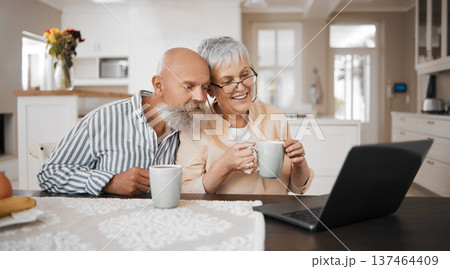 Laptop, video call and senior couple in a kitchen with coffee, conversation and bond at home. Love, retirement and elderly man with old woman in a house with tea, speaking or online communication 137464409