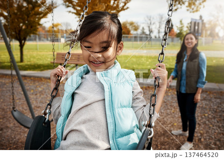 Asian family, smile or swinging with girl and mother outdoor together for bonding or having fun. Afternoon, playful child or weekend with happy daughter and single parent woman in park for break Asian family, smile or swinging with girl and mother outdoor together for bonding or having fun. Afternoon, playful child or weekend with happy daughter and single parent woman in park for break 137464520