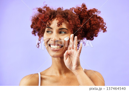 Skincare, studio face or happy woman with cream for wellness care, skin protection and test facial hydration product. Sunscreen, happiness or clean person with cosmetics ointment on purple background Skincare, studio face or happy woman with cream for wellness care, skin protection and test facial hydration product. Sunscreen, happiness or clean person with cosmetics ointment on purple background 137464540