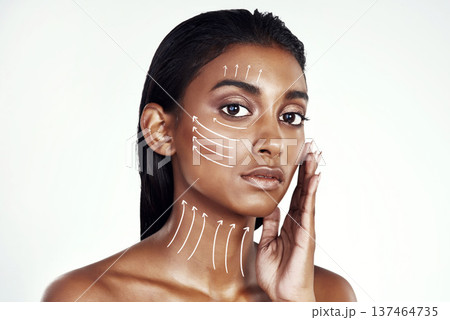 Plastic surgery portrait, arrow lines and woman touch beauty filler results, facial transformation change or anti aging wellness. Aesthetic face lift, spa studio or Indian patient on white background Plastic surgery portrait, arrow lines and woman touch beauty filler results, facial transformation change or anti aging wellness. Aesthetic face lift, spa studio or Indian patient on white background 137464735