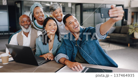 Selfie, meeting and planning with friends in the office together taking a picture for memory. Collaboration, smile and diversity with a happy business team in a creative workplace for a photograph Selfie, meeting and planning with friends in the office together taking a picture for memory. Collaboration, smile and diversity with a happy business team in a creative workplace for a photograph 137464935
