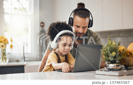 Father, child and laptop with headphones, home or happy for movie, music or streaming subscription. Dad, kid and computer for education, learning or help for online course in interracial family house Father, child and laptop with headphones, home or happy for movie, music or streaming subscription. Dad, kid and computer for education, learning or help for online course in interracial family house 137465567