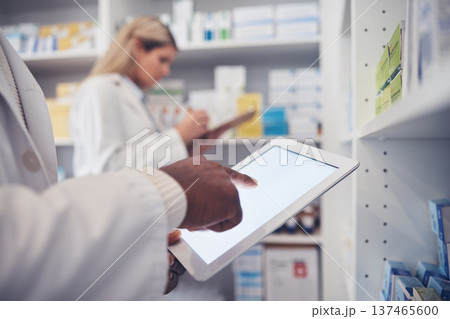 Tablet screen, person and pharmacist hands typing, scroll or search clinic database for product, pills or medicine. Pharmacy inventory, online research and closeup doctor doing supplements stock take 137465600