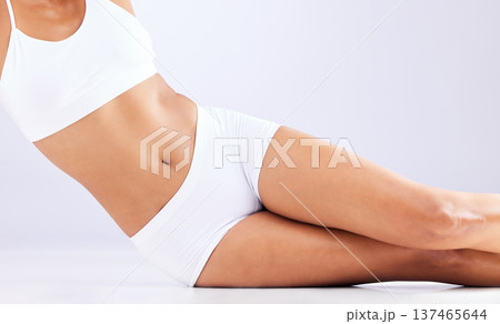 Skincare, health and stomach of woman in studio for healthy body, wellness and weightloss. Fitness, lose weight and abdomen of person on white background in underwear for diet, detox and self care 137465644