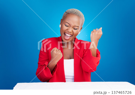 Business, excited and black woman with celebration, winning and success on a blue studio background. Person, model and entrepreneur with startup, happiness and victory with achievement and promotion Business, excited and black woman with celebration, winning and success on a blue studio background. Person, model and entrepreneur with startup, happiness and victory with achievement and promotion 137465726