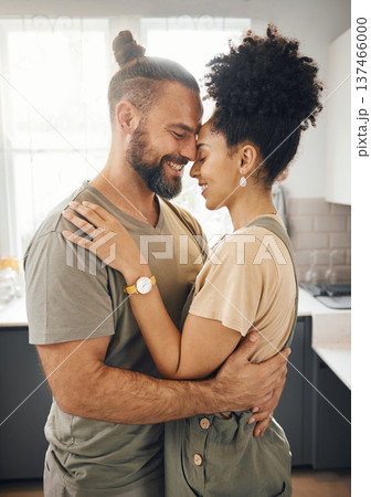 Interracial couple, hug and forehead touch in kitchen, love and bonding with happiness while at home. Trust, support and commitment, affection and embrace with people in a healthy relationship Interracial couple, hug and forehead touch in kitchen, love and bonding with happiness while at home. Trust, support and commitment, affection and embrace with people in a healthy relationship 137466000