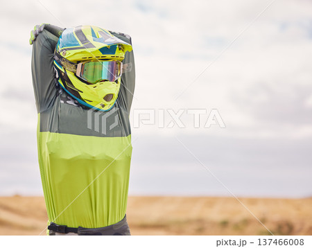 Sports, stretching and man with helmet in nature for training, workout and performance. Travel, mockup space and person outdoors for motor cycling for adventure, freedom and adrenaline in desert Sports, stretching and man with helmet in nature for training, workout and performance. Travel, mockup space and person outdoors for motor cycling for adventure, freedom and adrenaline in desert 137466008
