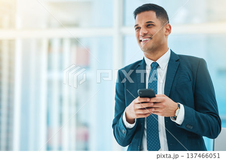 Phone, thinking and mockup with a business man in his office, typing a text message for communication. Mobile, idea and networking with a happy young employee chatting online in a corporate workplace 137466051