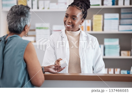 Pharmacist, pharmacy and customer for medicine service, healthcare advice and clinic solution or support by counter. African doctor, women or medical people with box of pills, product or retail drugs Pharmacist, pharmacy and customer for medicine service, healthcare advice and clinic solution or support by counter. African doctor, women or medical people with box of pills, product or retail drugs 137466085