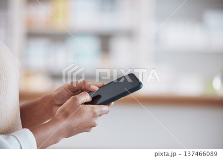 Woman pharmacist with smartphone, typing in clinic and research for medical information, email or online chat. Phone, networking and mockup, doctor in pharmacy checking social media or internet news Woman pharmacist with smartphone, typing in clinic and research for medical information, email or online chat. Phone, networking and mockup, doctor in pharmacy checking social media or internet news 137466089