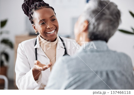 Smile, black woman or doctor consulting a patient in meeting in hospital for healthcare feedback or support. Happy, medical or nurse with a mature person talking or speaking of test results or advice Smile, black woman or doctor consulting a patient in meeting in hospital for healthcare feedback or support. Happy, medical or nurse with a mature person talking or speaking of test results or advice 137466118