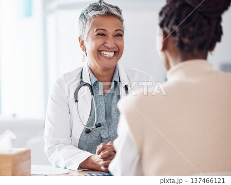 Happy woman, mature or doctor consulting a patient in hospital for healthcare help, feedback or support. People, medical or excited nurse with a person talking or speaking of test results or advice 137466121