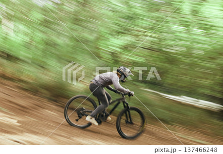 Bicycle, woods and man travel, blur and workout outdoor in forest for healthy body. Mountain bike, nature and athlete training, cycling fast and off road adventure on journey, freedom or sport race Bicycle, woods and man travel, blur and workout outdoor in forest for healthy body. Mountain bike, nature and athlete training, cycling fast and off road adventure on journey, freedom or sport race 137466248