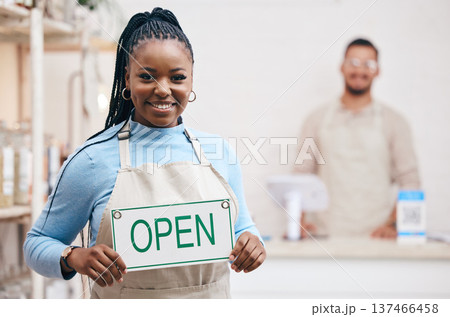 Open, sign or black woman with small business or restaurant happy for service in coffee shop, cafe or store with board. Smile, manager and portrait of entrepreneur ready for operations with billboard Open, sign or black woman with small business or restaurant happy for service in coffee shop, cafe or store with board. Smile, manager and portrait of entrepreneur ready for operations with billboard 137466458