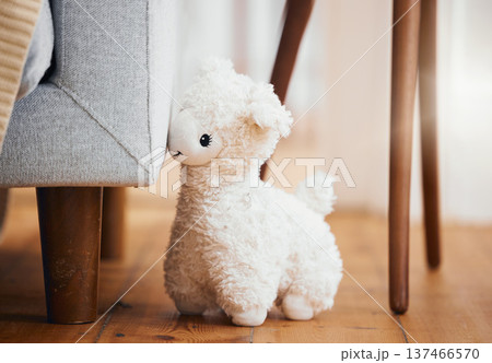 Teddy bear, empty room and toy on floor of home, background and alone by sofa in lounge of house. Abandoned, lonely and stuffed animal for grief, mental health, loss and sad or security by couch Teddy bear, empty room and toy on floor of home, background and alone by sofa in lounge of house. Abandoned, lonely and stuffed animal for grief, mental health, loss and sad or security by couch 137466570