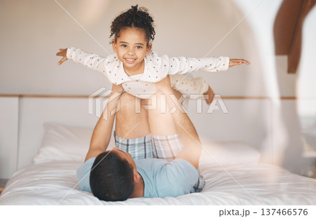 Kid, father and airplane games on bed for support or relax at home for crazy fun. Portrait, dad and happy girl child excited to fly in bedroom for freedom, fantasy and balance of play, care or energy Kid, father and airplane games on bed for support or relax at home for crazy fun. Portrait, dad and happy girl child excited to fly in bedroom for freedom, fantasy and balance of play, care or energy 137466576
