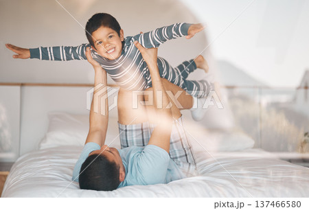 Kid, father and smile on bed for airplane games, support and relax at home for crazy fun. Portrait, dad and boy child excited to fly in bedroom for freedom, fantasy or balance of play, care or energy 137466580