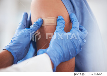 Healthcare, vaccine and plaster on arm of person in hospital for covid, flu or immunization closeup, Doctor, hands and zoom on patient at a clinic for medical, consultation and disease vaccination Healthcare, vaccine and plaster on arm of person in hospital for covid, flu or immunization closeup, Doctor, hands and zoom on patient at a clinic for medical, consultation and disease vaccination 137466648