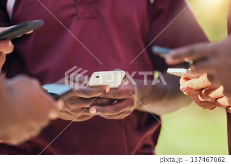 Sports, teamwork and phone with hands of people on field for networking, communication and social media. Contact, fitness and health with closeup of friends in stadium for internet and connection 137467062