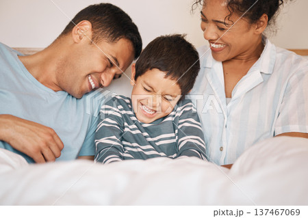 Happy, tickle and funny with family in bedroom for playful, morning and love. Care, support and wake up with parents and boy child laughing in bed at home for weekend, positive and relax together Happy, tickle and funny with family in bedroom for playful, morning and love. Care, support and wake up with parents and boy child laughing in bed at home for weekend, positive and relax together 137467069