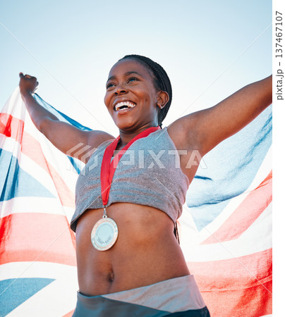 Fitness, winning and black woman with achievement, UK flag and sports with competition, victory and champion. African person, athlete or winner with British symbol, pride and medal with celebration 137467107