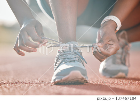 Shoes, hands and tie lace, running and fitness with person on race track, athlete and sports outdoor. Exercise, start and runner ready for cardio, marathon or triathlon with health and sneakers 137467184