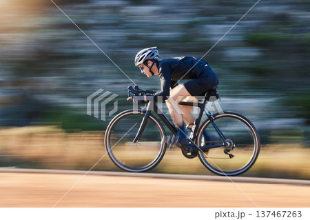 Motion blur, speed and cyclist on bicycle on road in mountain with helmet, exercise adventure trail and fitness. Cycling race, nature and man with bike for fast workout, training motivation or energy Motion blur, speed and cyclist on bicycle on road in mountain with helmet, exercise adventure trail and fitness. Cycling race, nature and man with bike for fast workout, training motivation or energy 137467263
