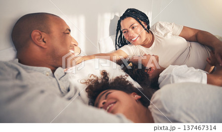 Family, morning and happy in home bedroom bed playing, bonding and gratitude for love. African woman, man and kids lying together for security, support or relax with mother and father on holiday Family, morning and happy in home bedroom bed playing, bonding and gratitude for love. African woman, man and kids lying together for security, support or relax with mother and father on holiday 137467314