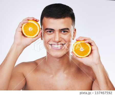 Beauty, orange and skincare with portrait of man in studio for health, detox and natural cosmetics. Vitamin c, nutrition and summer with face of person and fruit on white background for self care Beauty, orange and skincare with portrait of man in studio for health, detox and natural cosmetics. Vitamin c, nutrition and summer with face of person and fruit on white background for self care 137467592