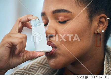 Woman, face and breathe asthma pump for help with health risk, cough treatment and air at home. Closeup, sick african person and spray medicine inhaler for lungs, oxygen or wellness of emergency care Woman, face and breathe asthma pump for help with health risk, cough treatment and air at home. Closeup, sick african person and spray medicine inhaler for lungs, oxygen or wellness of emergency care 137467610