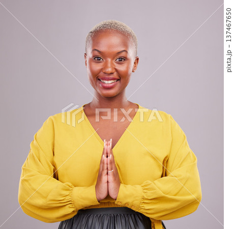 Woman, prayer hands and portrait in faith, religion and hope or thank you for career opportunity on studio background. Christian or African person namaste, gratitude emoji and happy for ngo business Woman, prayer hands and portrait in faith, religion and hope or thank you for career opportunity on studio background. Christian or African person namaste, gratitude emoji and happy for ngo business 137467650