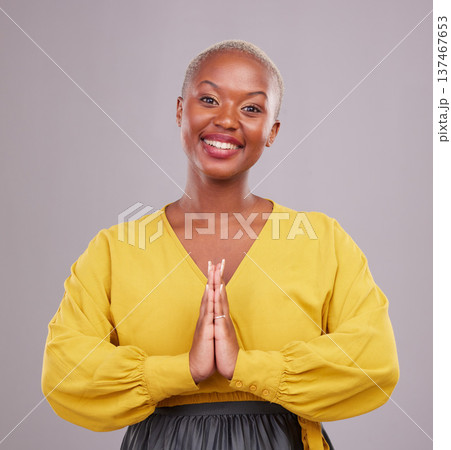 Woman, praying and hands together in religion, faith and hope or thank you of career opportunity on studio background. Christian or African person in gratitude portrait, peace emoji and ngo business 137467653