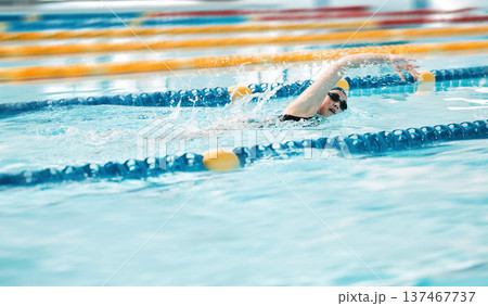 Swimming exercise, pool and sports person training for challenge, freestyle competition or performance workout. Gym club swimmer, water splash and active athlete cardio, race or practice stroke Swimming exercise, pool and sports person training for challenge, freestyle competition or performance workout. Gym club swimmer, water splash and active athlete cardio, race or practice stroke 137467737
