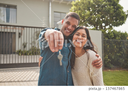 Happy couple, portrait and real estate with keys in property, investment or new home together. Man and woman or homeowners smile for moving in, buying or building loan in asset finance or investing 137467865