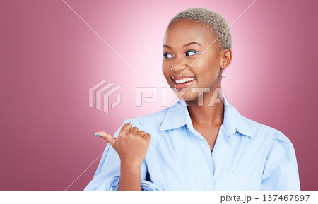 Pointing finger, smile and a woman in studio with hand for advertising, marketing or announcement. Happy face of an excited African person on pink background for choice, presentation or mockup space 137467897