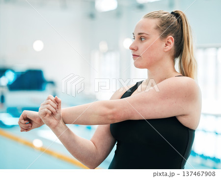 Swimmer, exercise and woman stretching, workout and wellness for competition, fitness and active lifestyle. Girl, athlete and person stretch arms, health and warm up with competitive sport and break 137467908