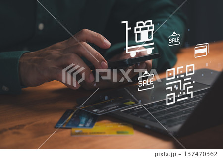 Online shopping concept, person using a smartphone with credit cards, QR code, and sale icons, highlighting digital payments, e-commerce convenience, secure transactions, and modern retail technology. Online shopping concept, person using a smartphone with credit cards, QR code, and sale icons, highlighting digital payments, e-commerce convenience, secure transactions, and modern retail technology. 137470362