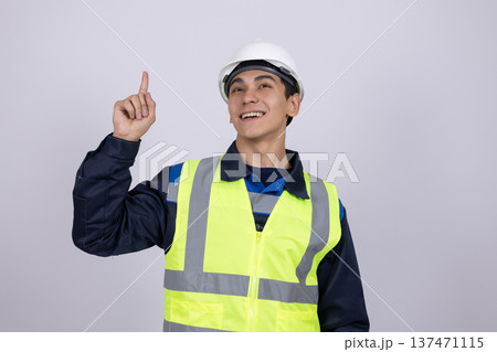 Worker pointing finger up on white background Worker pointing finger up on white background 137471115