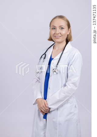 Female doctor with stethoscope looking at camera Female doctor with stethoscope looking at camera 137471135