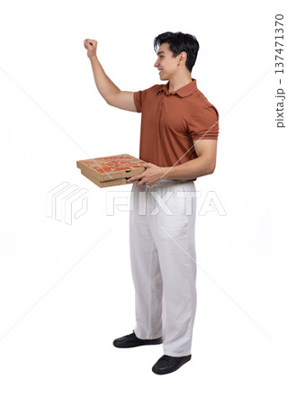 Young man walking with a laptop in his hand Young man walking with a laptop in his hand 137471370