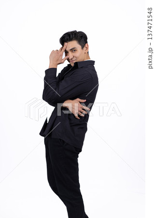 Young man in black shirt posing on white background in studio 137471548