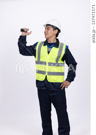 Professional builder in hard hat looking at something up Professional builder in hard hat looking at something up 137471571