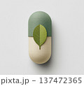 カプセルと葉のイラスト 自然由来のサプリメント・薬のイメージ ペーパークラフト風 オーガニック ヘル 137472365