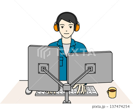 イヤーマフを着用し周囲の音を気にせず設計業務に励む男性技術者 137474254