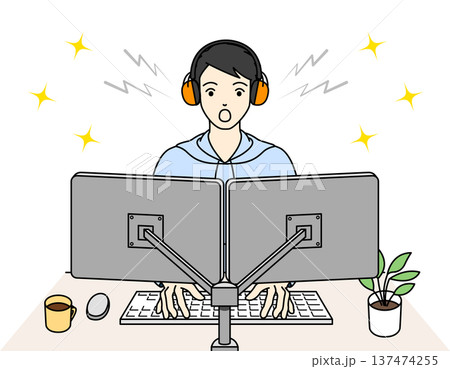 聴覚過敏の対策でイヤーマフを使いプログラミングを成功させる男性 137474255