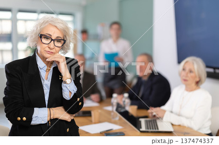 Upset senior female conference participant or partner is reprimanded 137474337