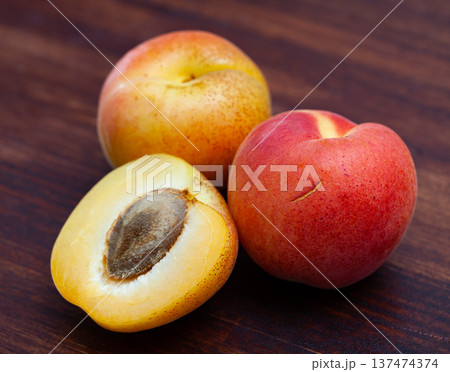 Image of delicious ripe apricots fruit on wooden surface 137474374