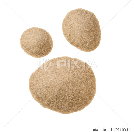 Desert sand pile isolated on a white background, top view. Dry beach sand isolated, top view. 137476539