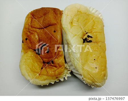 two loaves of bread with chocolate sprinkles topping two loaves of bread with chocolate sprinkles topping 137476997