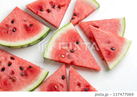 Freshly Cut Watermelon Slices Arranged on a White Background for Summer Refreshment 137477069